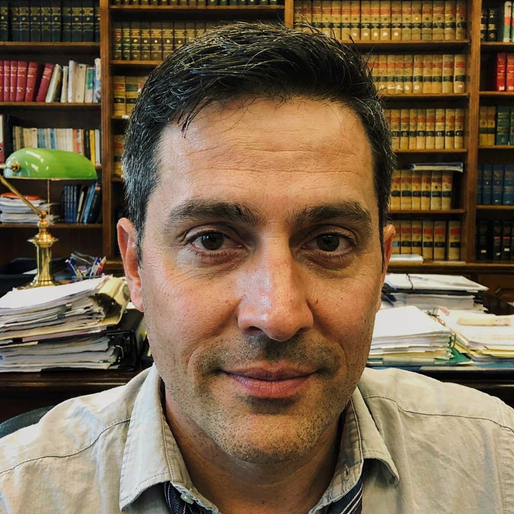 Law library selfie of a male attorney before headshot generation