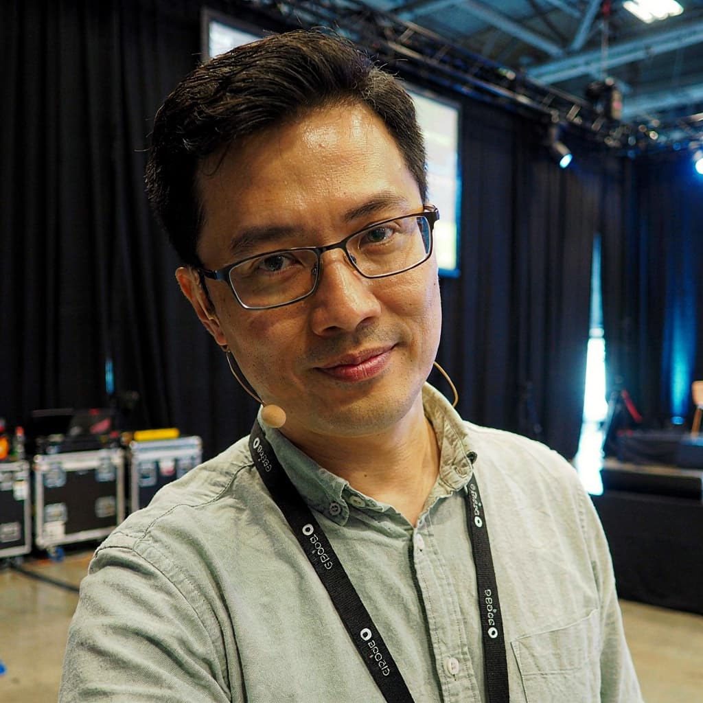 Backstage selfie of a male conference speaker before headshot generation